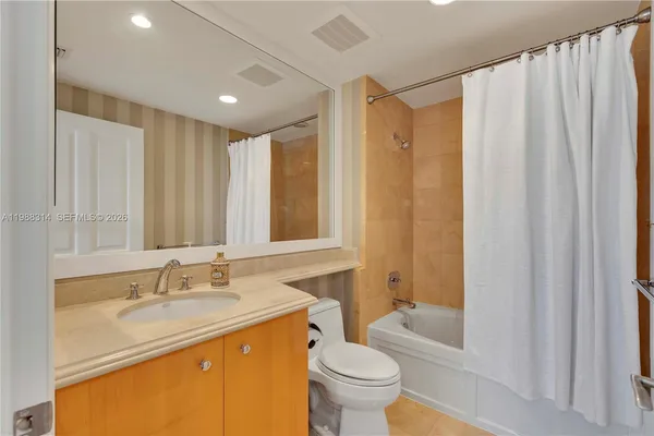 a front view of a building with a yard