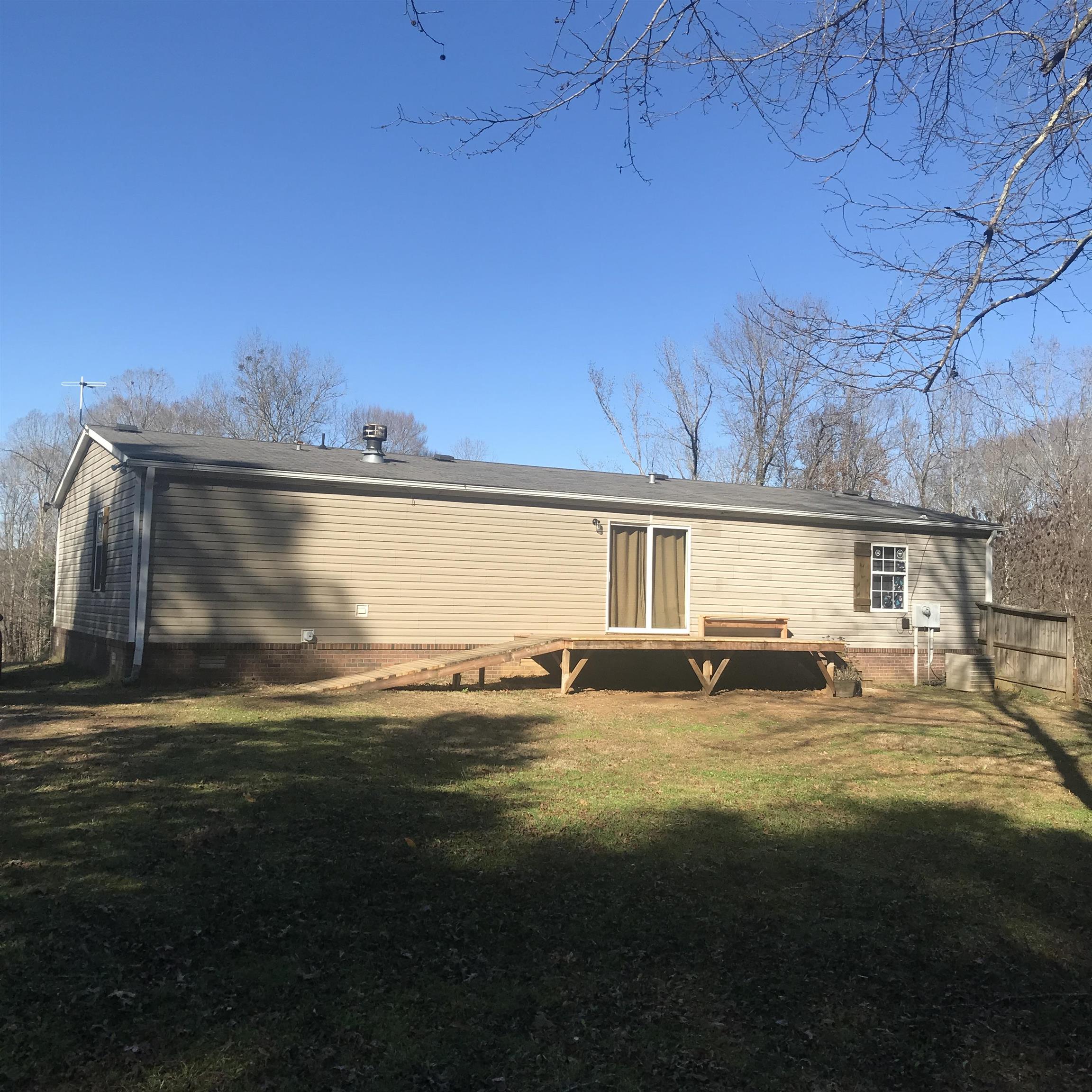 885 Highway 138 Toone, TN 38381 - Photo 5 of 25 a view of a swimming pool with an outdoor space and seating area