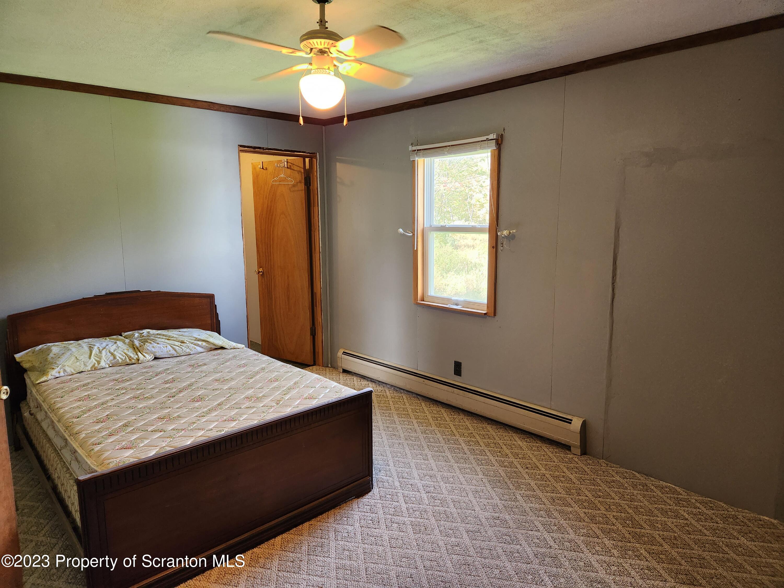 18775 Rte 187 Towanda Pa Towanda, PA 18848 - Photo 15 of 22 a bedroom with a bed and a window