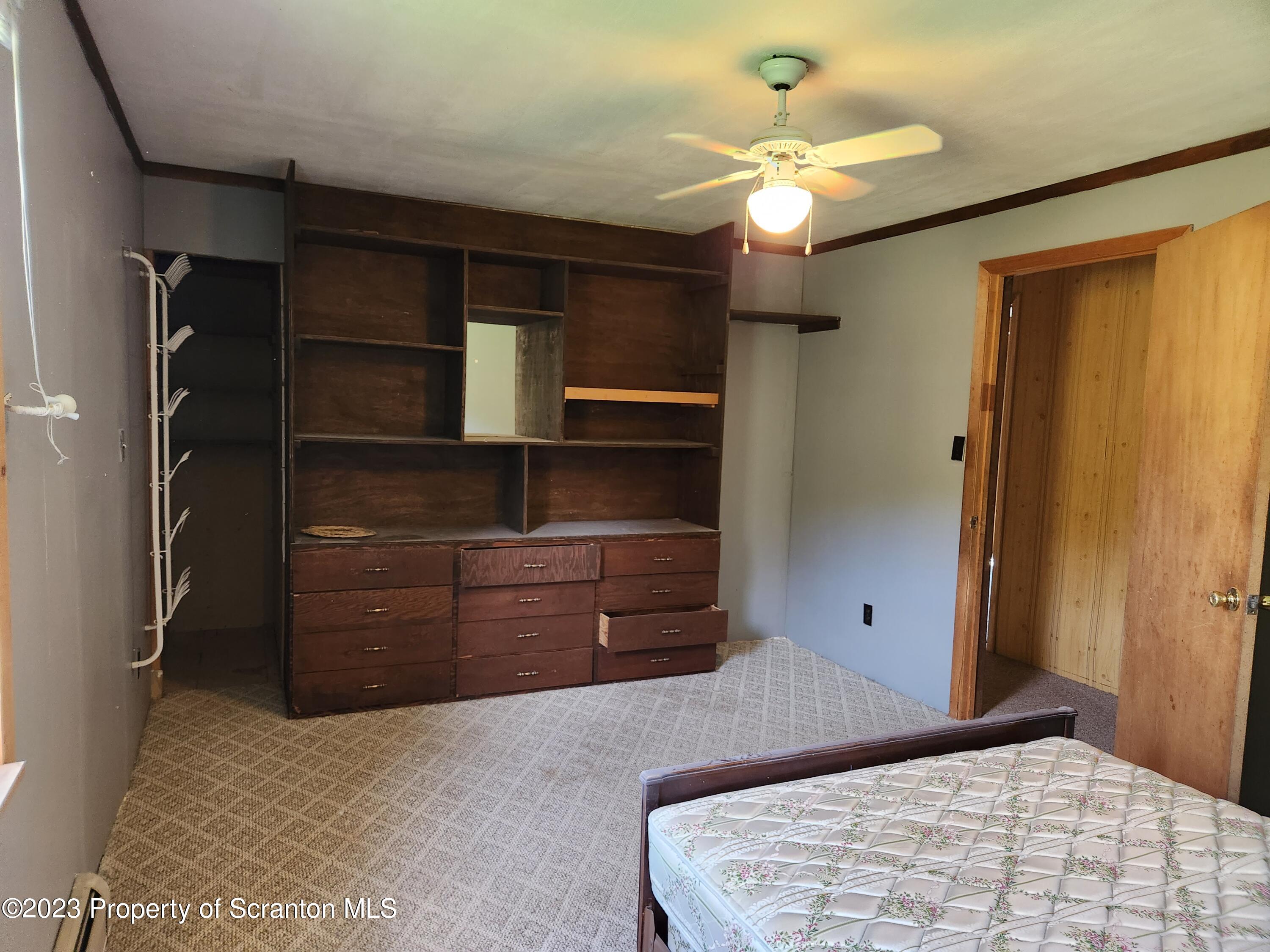 18775 Rte 187 Towanda Pa Towanda, PA 18848 - Photo 16 of 22 a bedroom with a bed and a ceiling fan