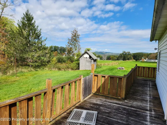 a view of a two chairs on the roof deck
