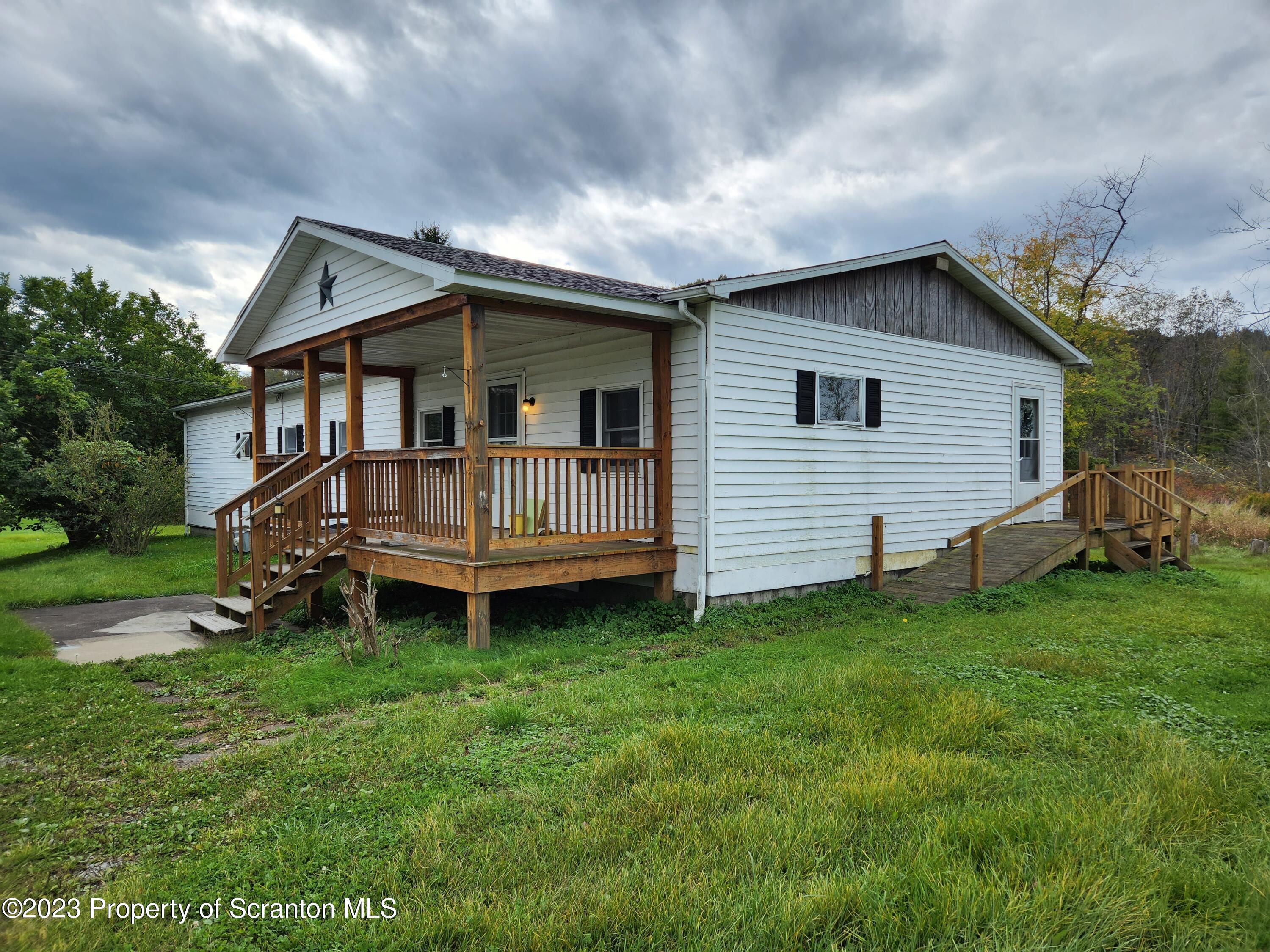 18775 Rte 187 Towanda Pa Towanda, PA 18848 - Photo 2 of 22 a backyard of a house with yard and trampoline