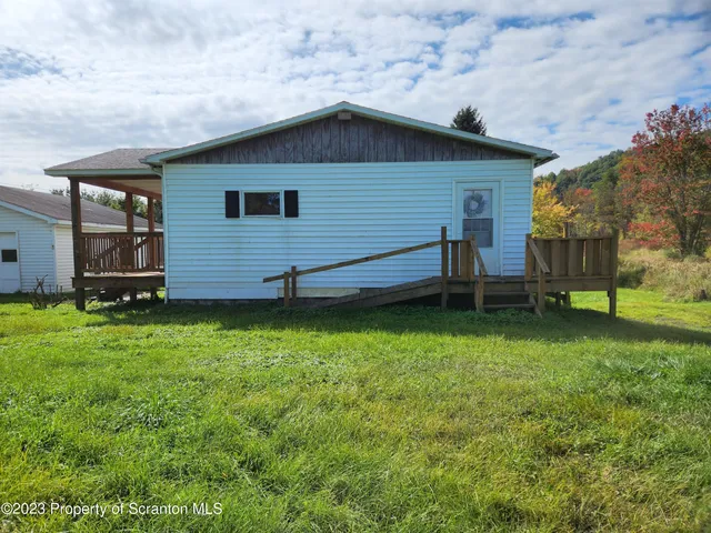 a backyard of a house with lots of green space