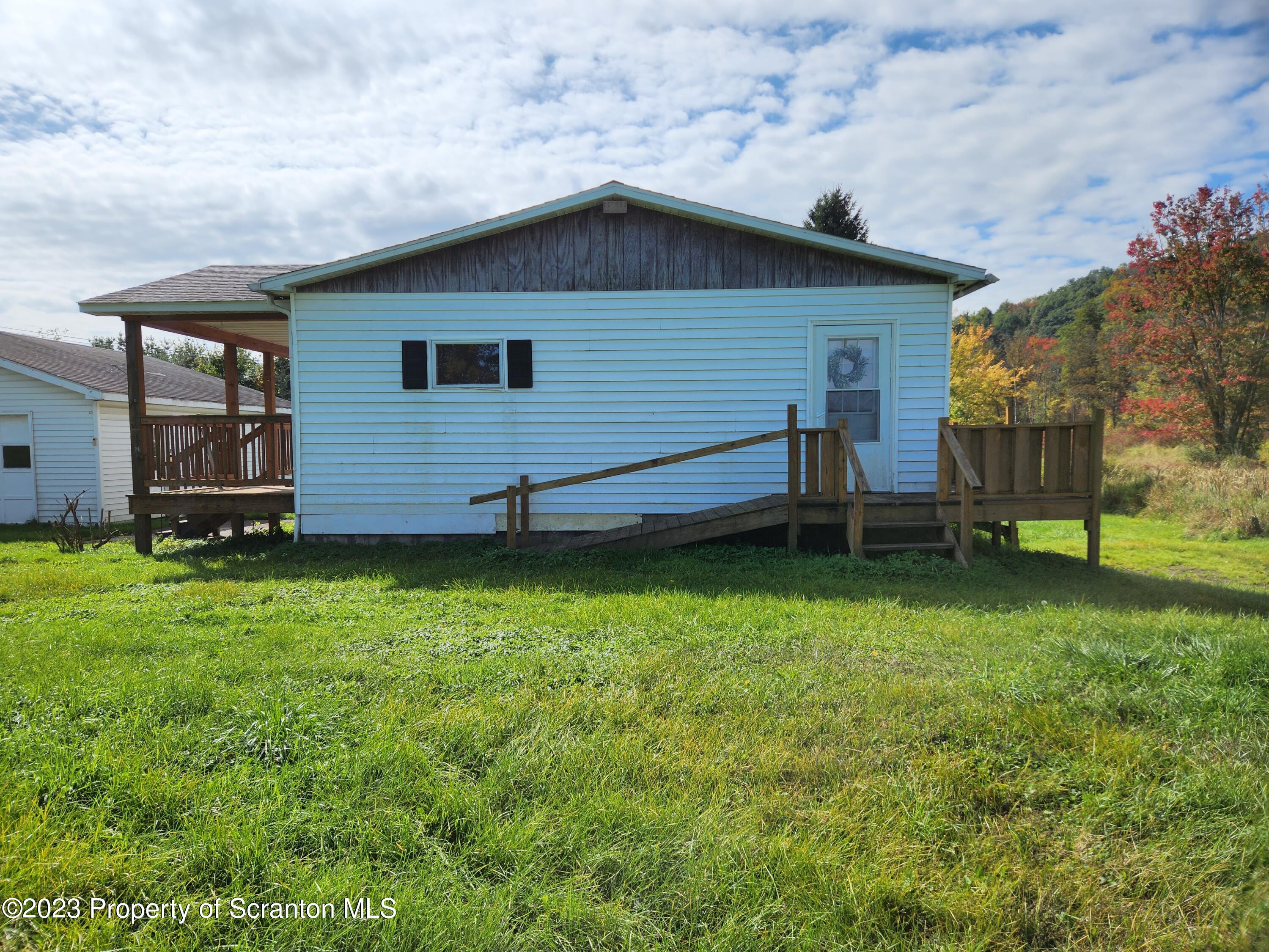 18775 Rte 187 Towanda Pa Towanda, PA 18848 - Photo 3 of 22 a backyard of a house with lots of green space