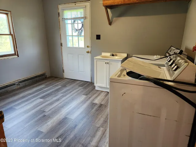 a utility room with dryer and washer