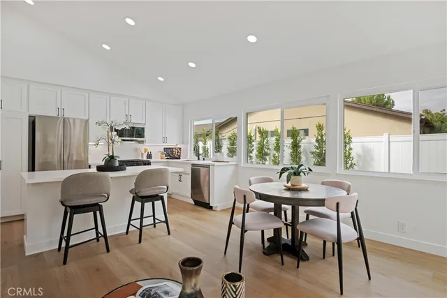 a view of a dining room with furniture window and outside view