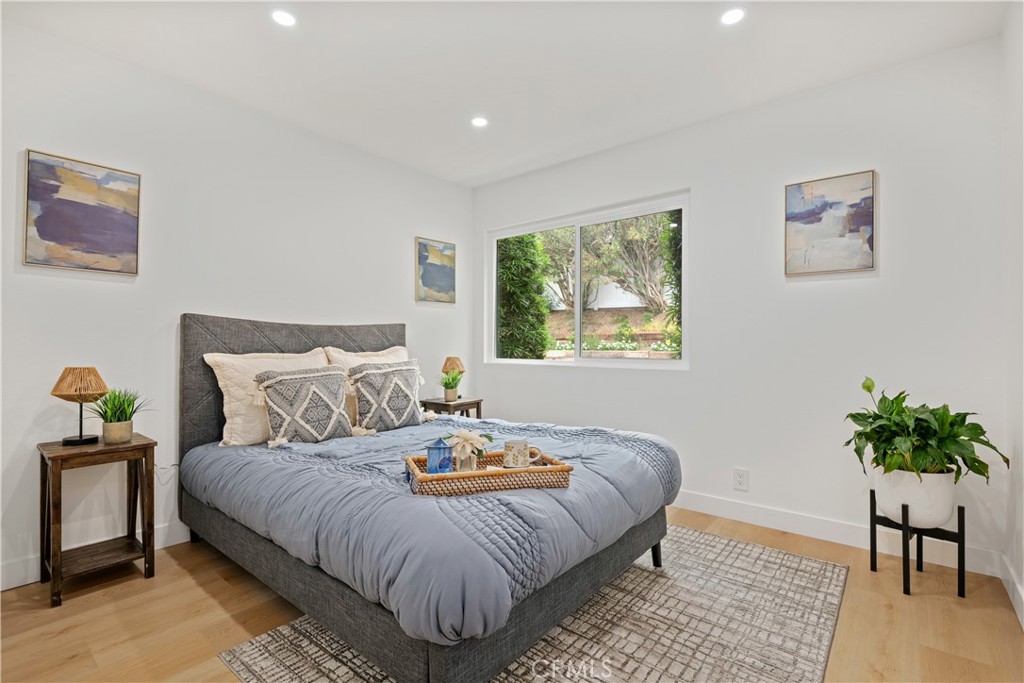 2108 Ardenwood Avenue Simi Valley, CA 93063 - Photo 24 of 33 a bedroom with a bed and a potted plant