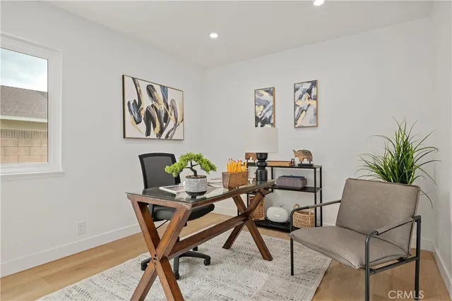 a dining room with furniture and wooden floor