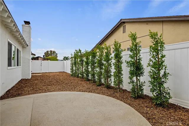 a front view of a house with a yard porch and outdoor seating
