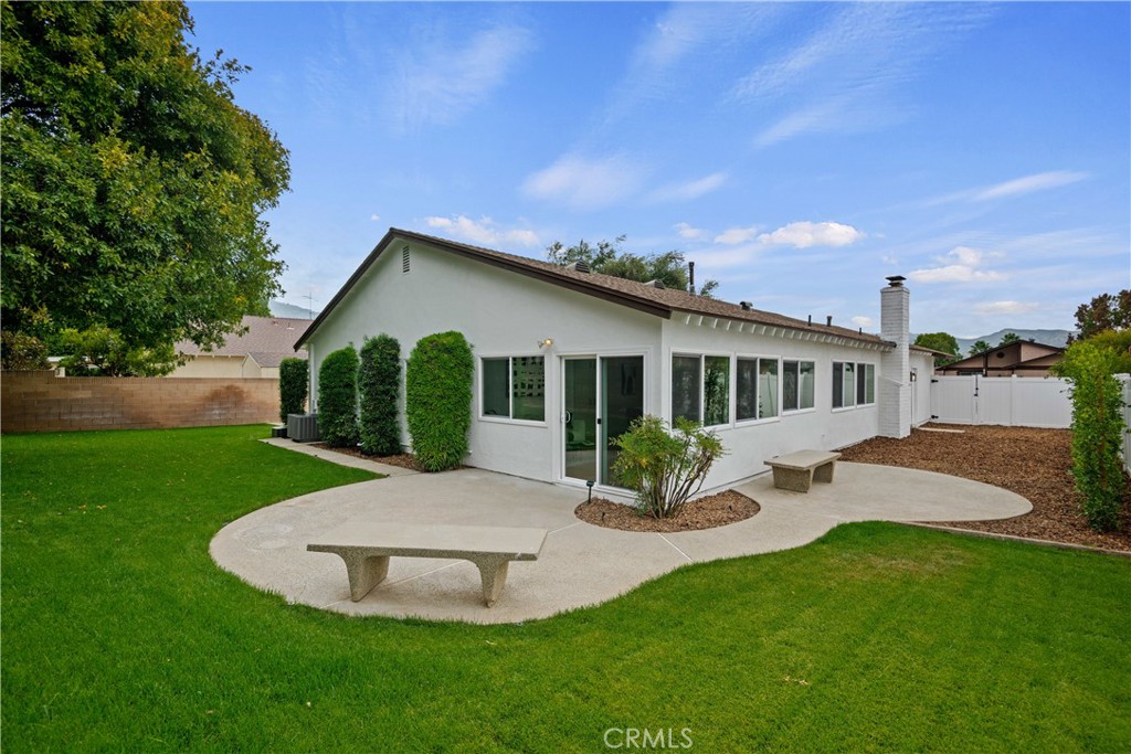 2108 Ardenwood Avenue Simi Valley, CA 93063 - Photo 30 of 33 a front view of a house with a yard porch and outdoor seating
