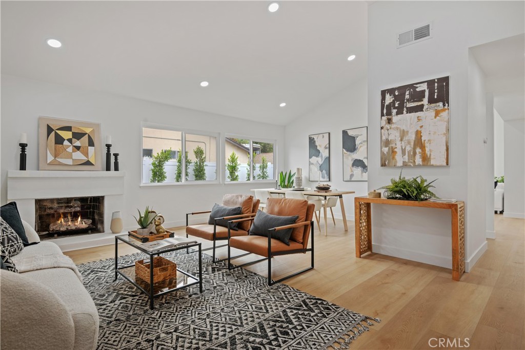 2108 Ardenwood Avenue Simi Valley, CA 93063 - Photo 7 of 33 a living room with furniture a fireplace and a table