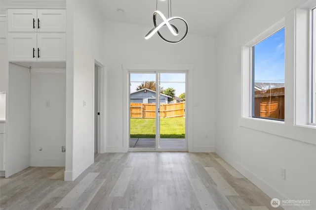 a kitchen with a sink a counter top space and stainless steel appliances