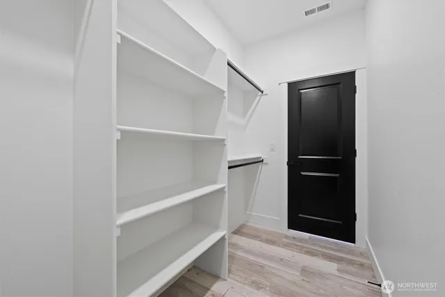 a view of a livingroom with wooden floor