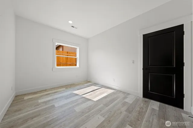 a view of a backyard with a garden and deck