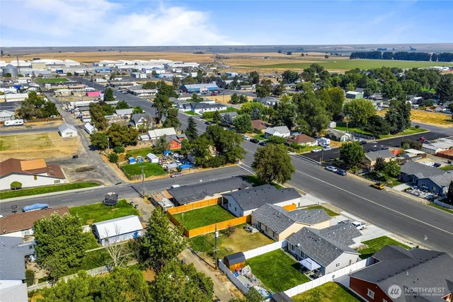 an aerial view of residential houses with outdoor space