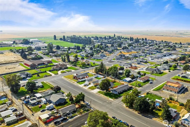a kitchen with refrigerator and cabinets