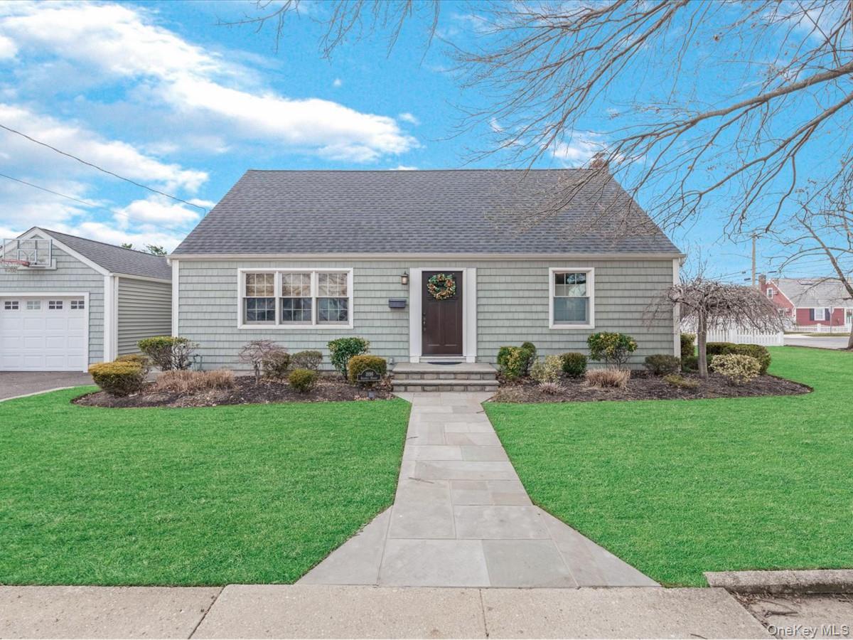 1896 Russell Street Bellmore, NY 11710 - Photo 1 of 21 a front view of house with yard and green space