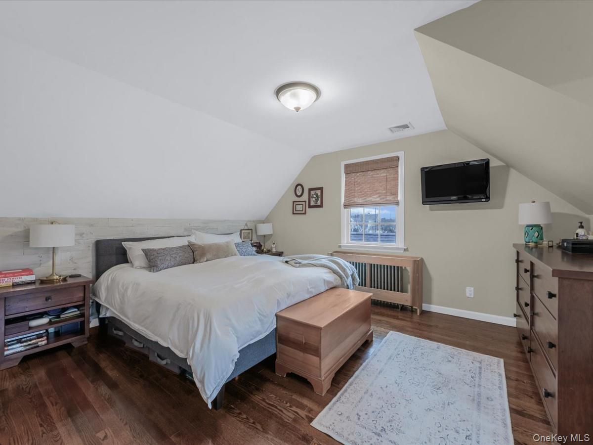 1896 Russell Street Bellmore, NY 11710 - Photo 13 of 21 a bedroom with a bed and a flat screen tv