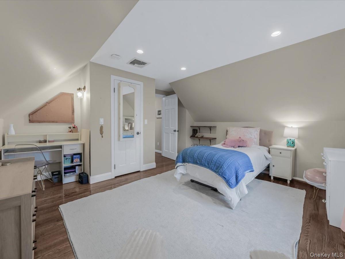 1896 Russell Street Bellmore, NY 11710 - Photo 15 of 21 a spacious bedroom with a bed and a view of kitchen