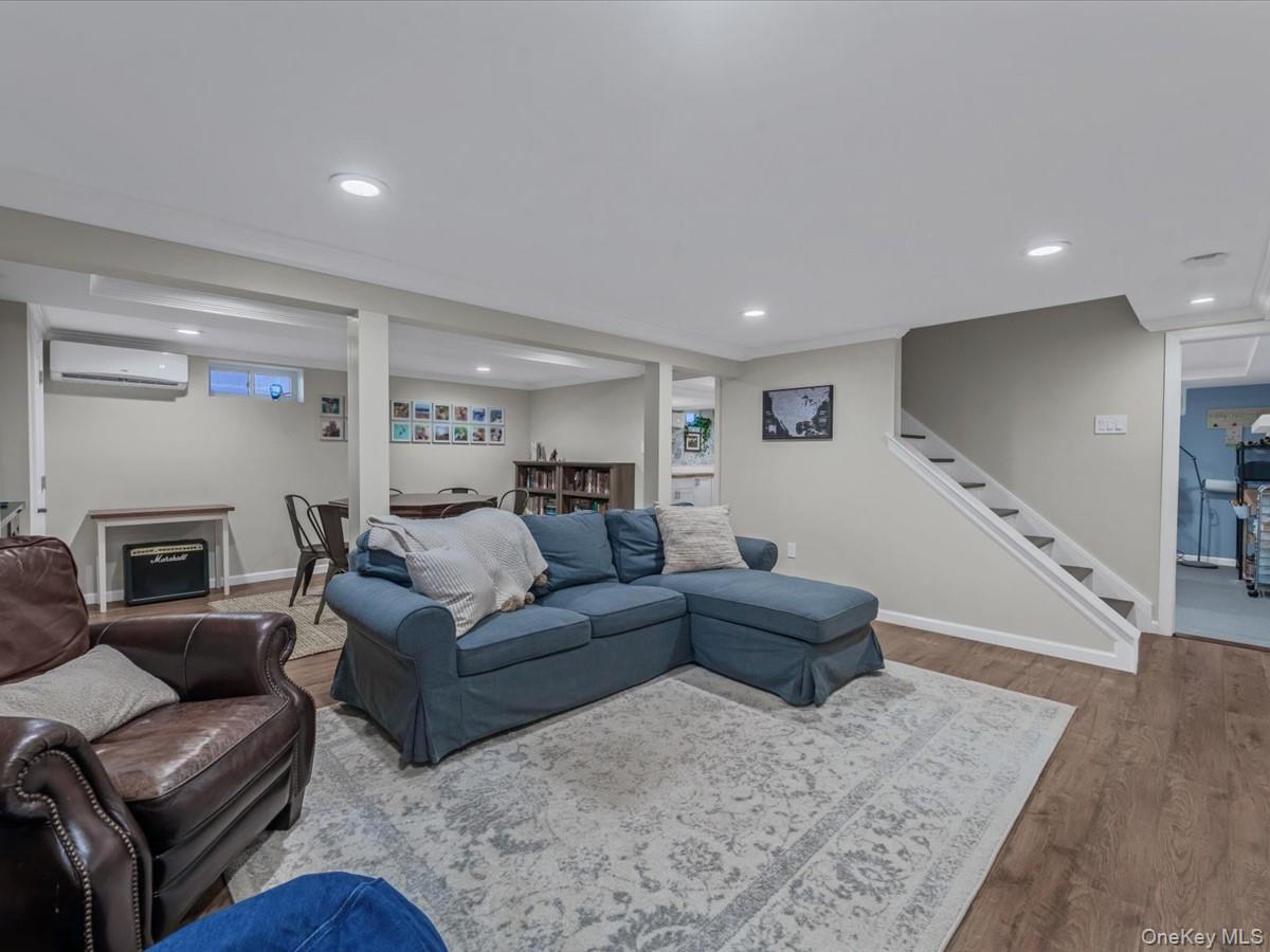 1896 Russell Street Bellmore, NY 11710 - Photo 17 of 21 a living room with furniture and a fireplace