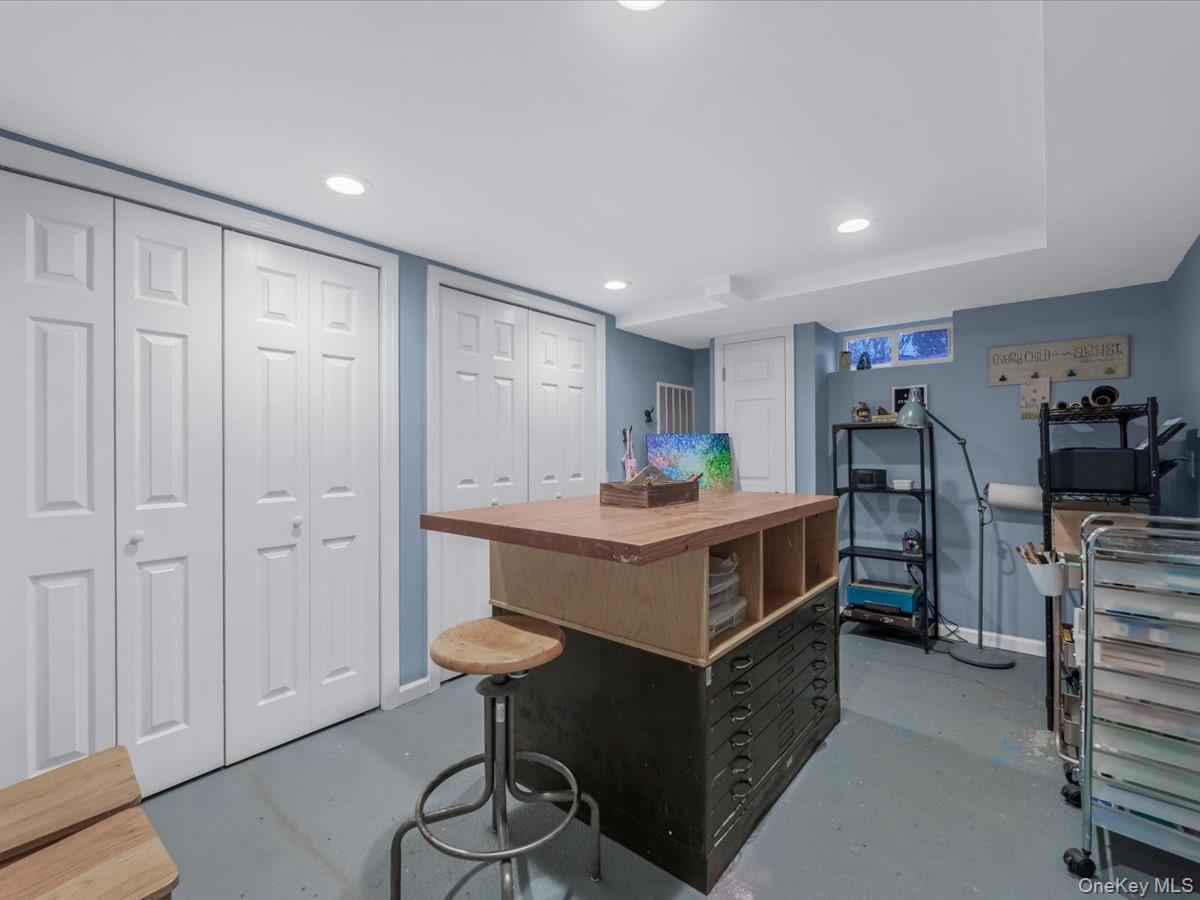 1896 Russell Street Bellmore, NY 11710 - Photo 18 of 21 a kitchen with stainless steel appliances a white cabinets and wooden floor
