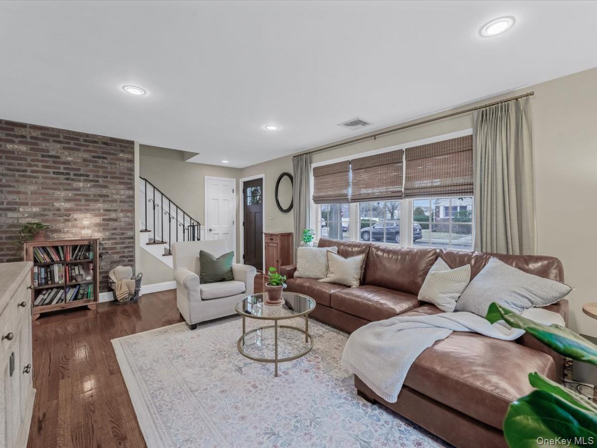 1896 Russell Street Bellmore, NY 11710 - Photo 6 of 21 a living room with furniture and a fireplace