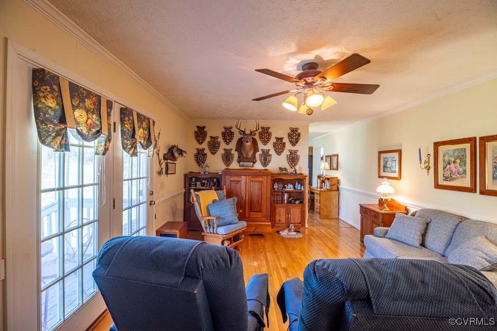 1416 Snead Spring Road Crewe, VA 23930 - Photo 17 of 35 a living room with furniture a chandelier and a window