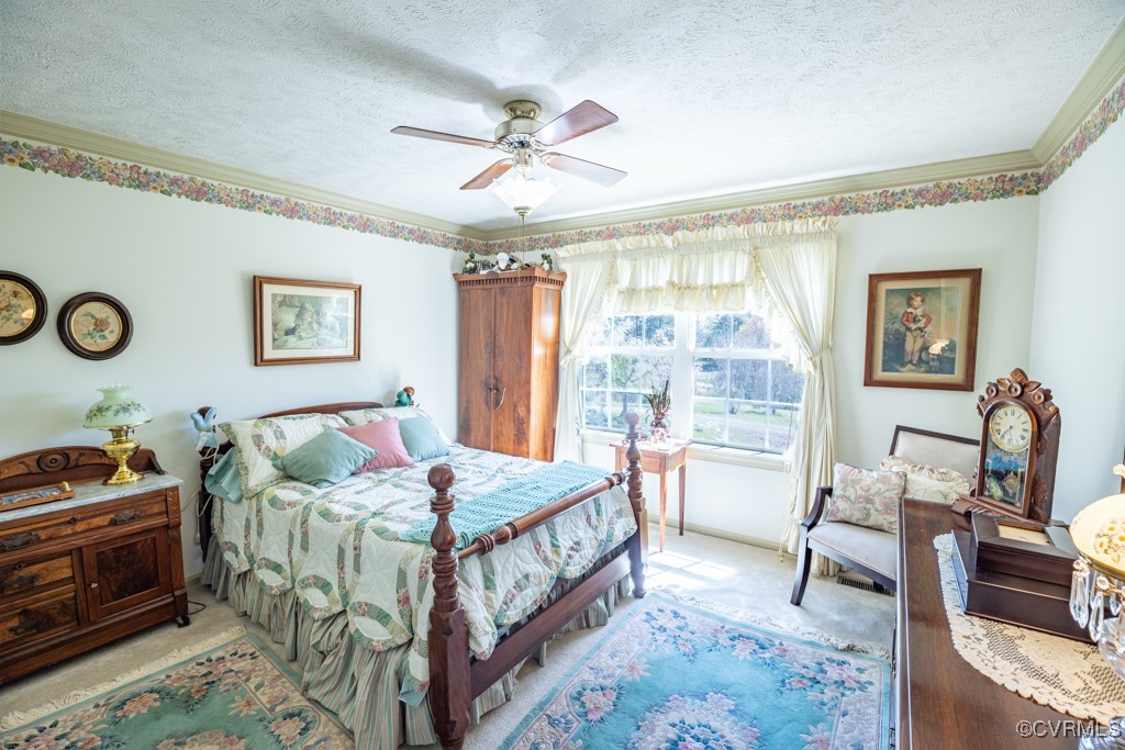 1416 Snead Spring Road Crewe, VA 23930 - Photo 30 of 35 a bedroom with a bed and a chandelier