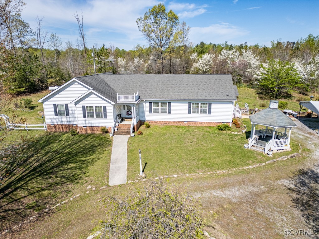 1416 Snead Spring Road Crewe, VA 23930 - Photo 32 of 35 a front view of a house with a garden