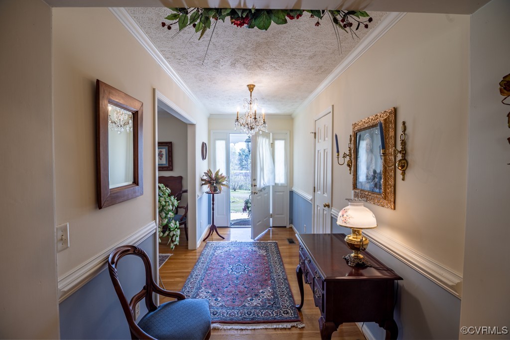 1416 Snead Spring Road Crewe, VA 23930 - Photo 4 of 35 a living room with furniture and a chandelier