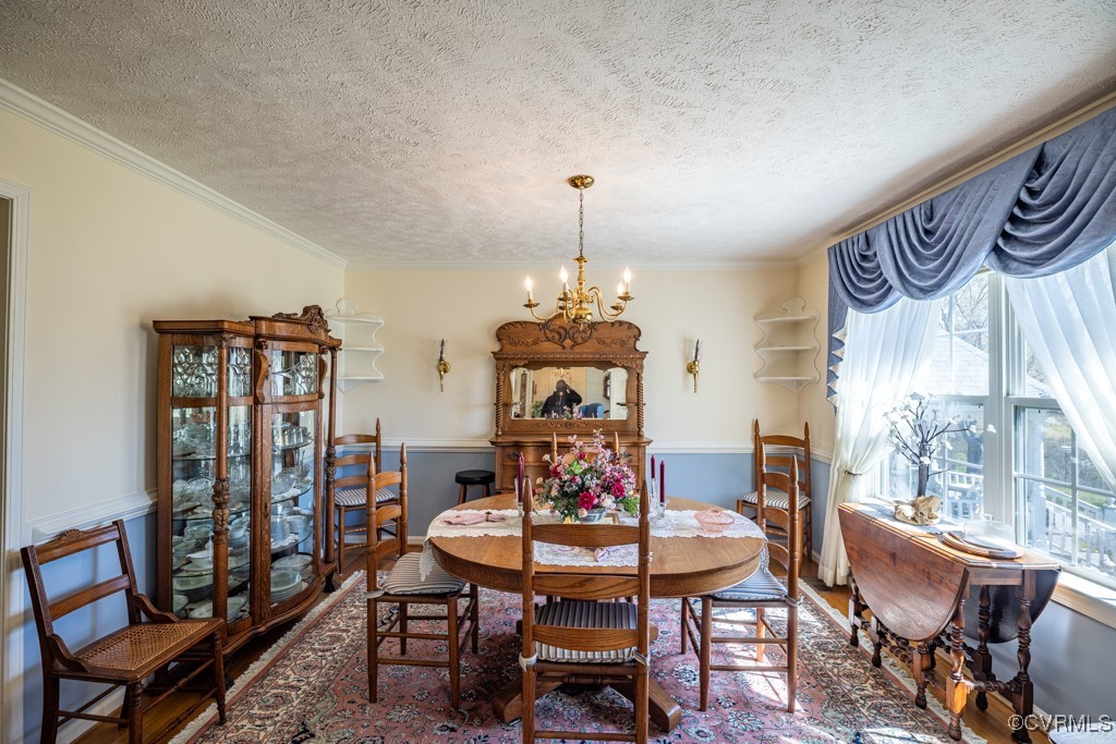 1416 Snead Spring Road Crewe, VA 23930 - Photo 7 of 35 a view of a dining room with furniture window and wooden floor