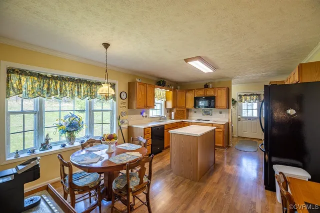 a kitchen with a sink stove and wooden cabinets