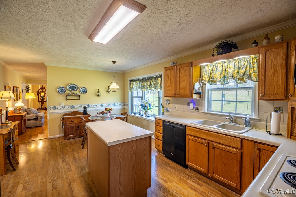 1416 Snead Spring Road Crewe, VA 23930 - Photo 10 of 35 a kitchen with a sink stove and wooden cabinets