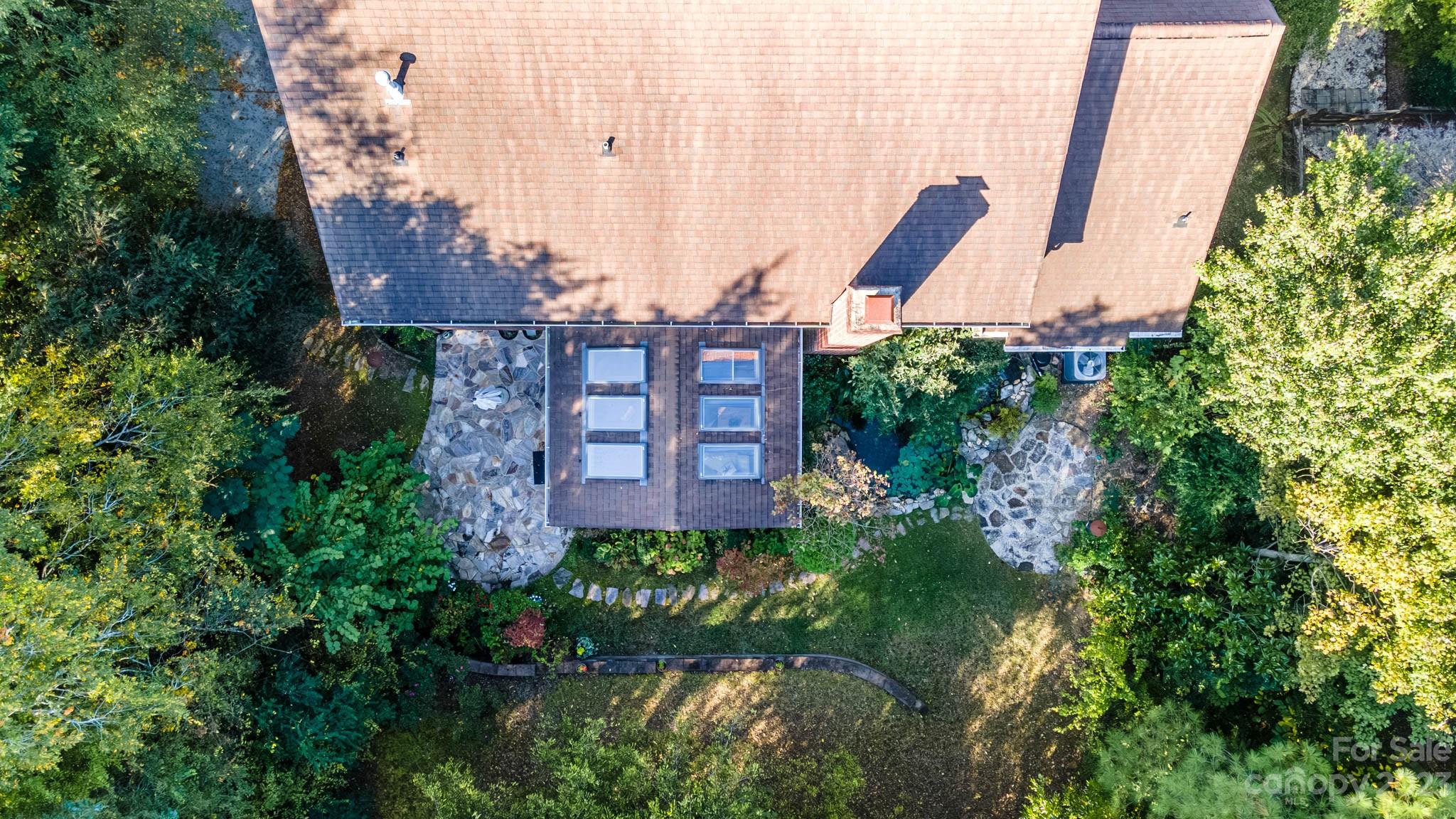 10507 Rougemont Lane Charlotte, NC 28277 - Photo 11 of 48 a view of a large building with a garden and plants