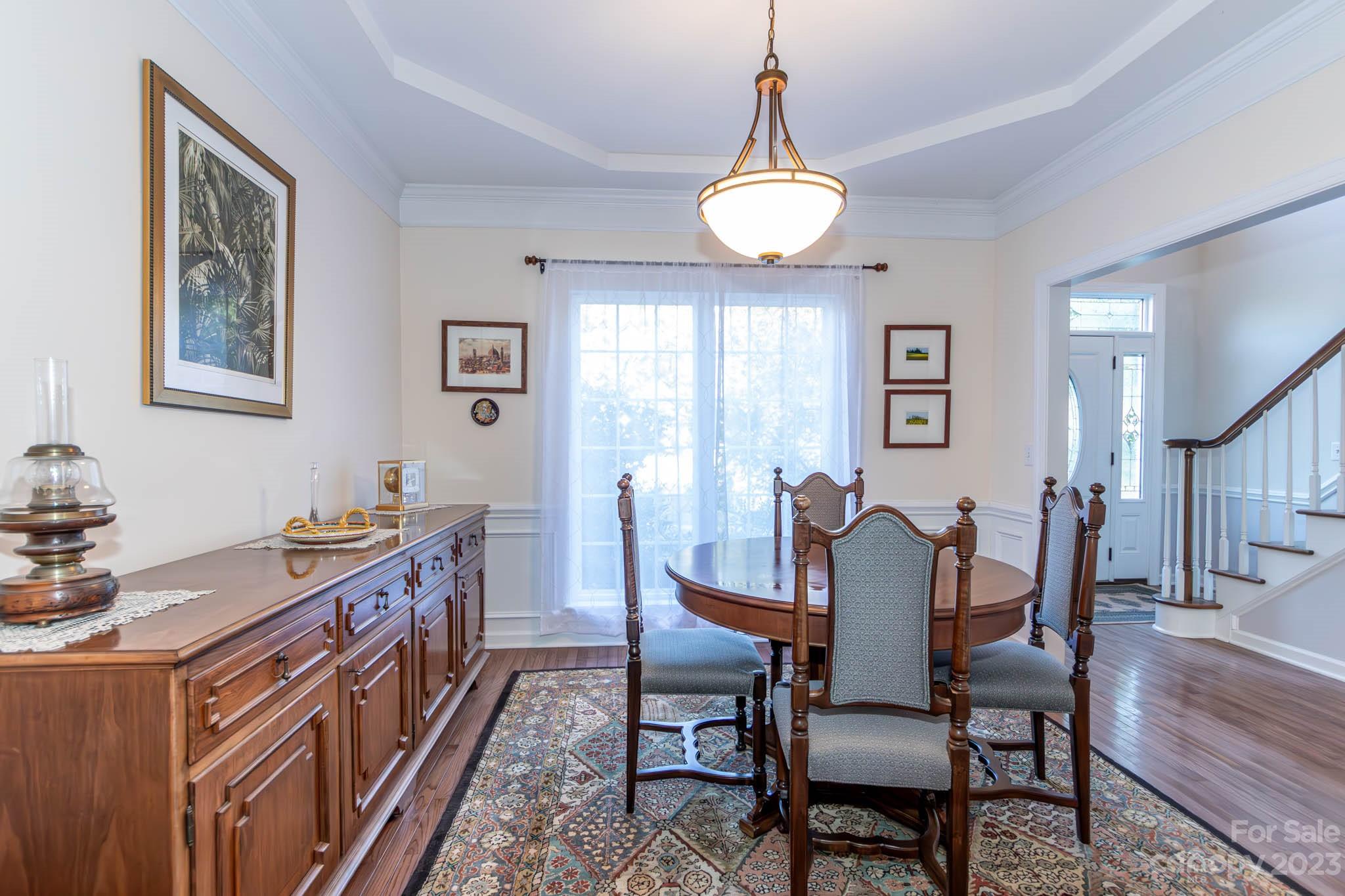 10507 Rougemont Lane Charlotte, NC 28277 - Photo 15 of 48 a view of a dining room with furniture and wooden floor