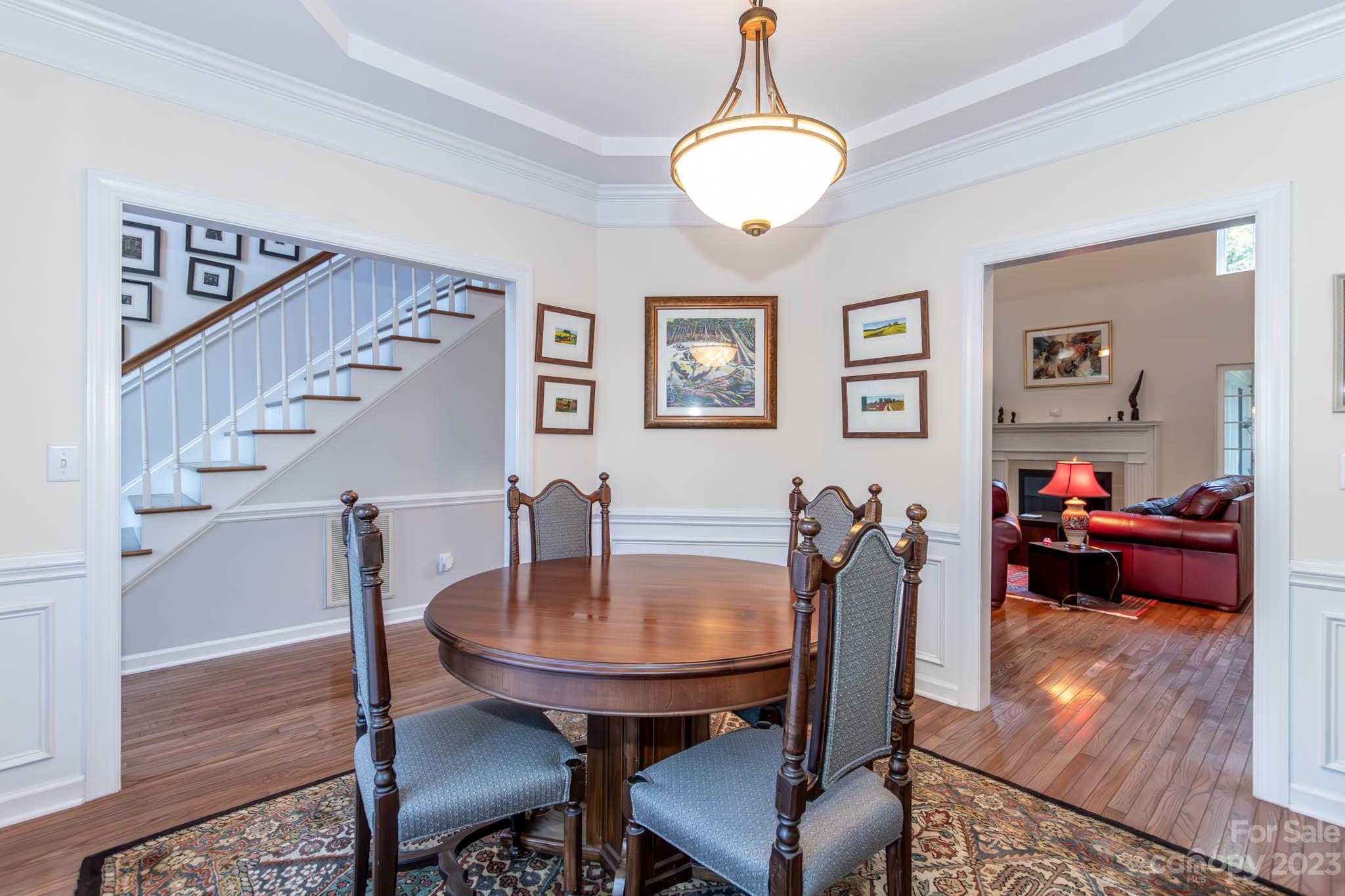 10507 Rougemont Lane Charlotte, NC 28277 - Photo 16 of 48 a view of a dining room with furniture and wooden floor
