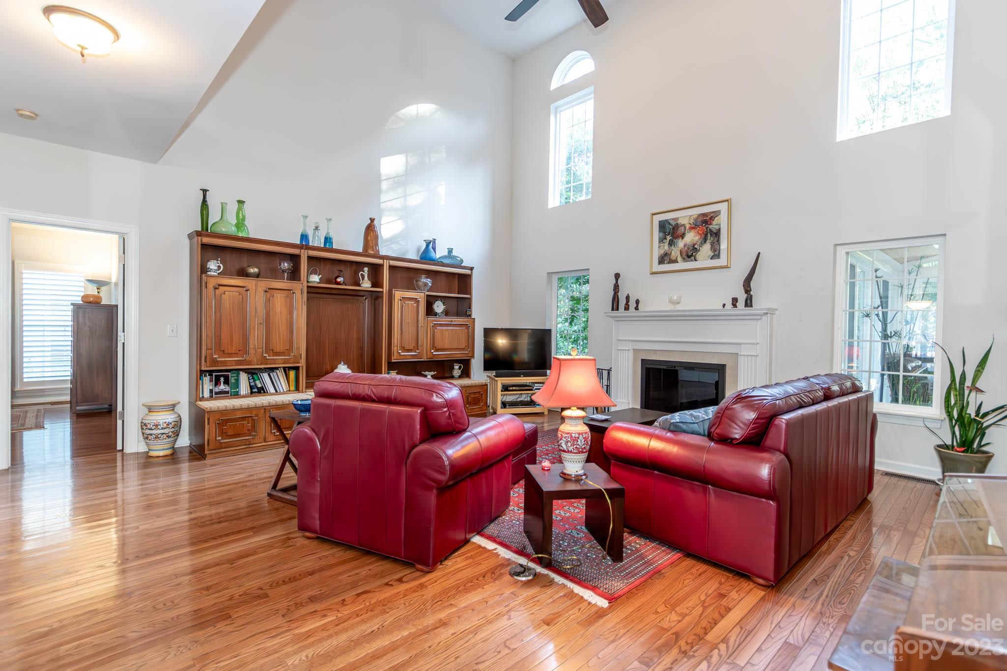 10507 Rougemont Lane Charlotte, NC 28277 - Photo 18 of 48 a living room with furniture a large window and a fireplace