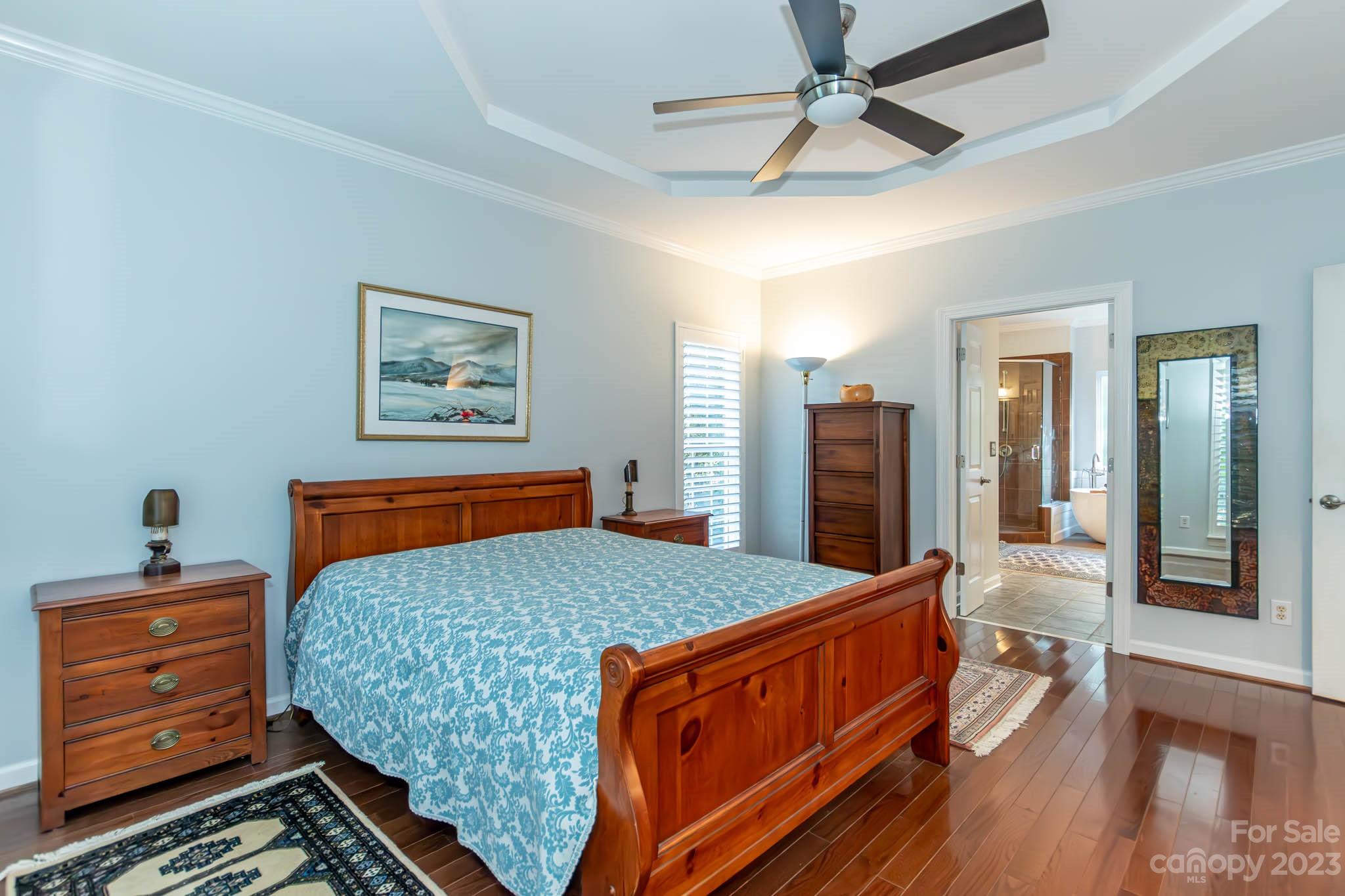 10507 Rougemont Lane Charlotte, NC 28277 - Photo 30 of 48 a bedroom with a bed and a dresser