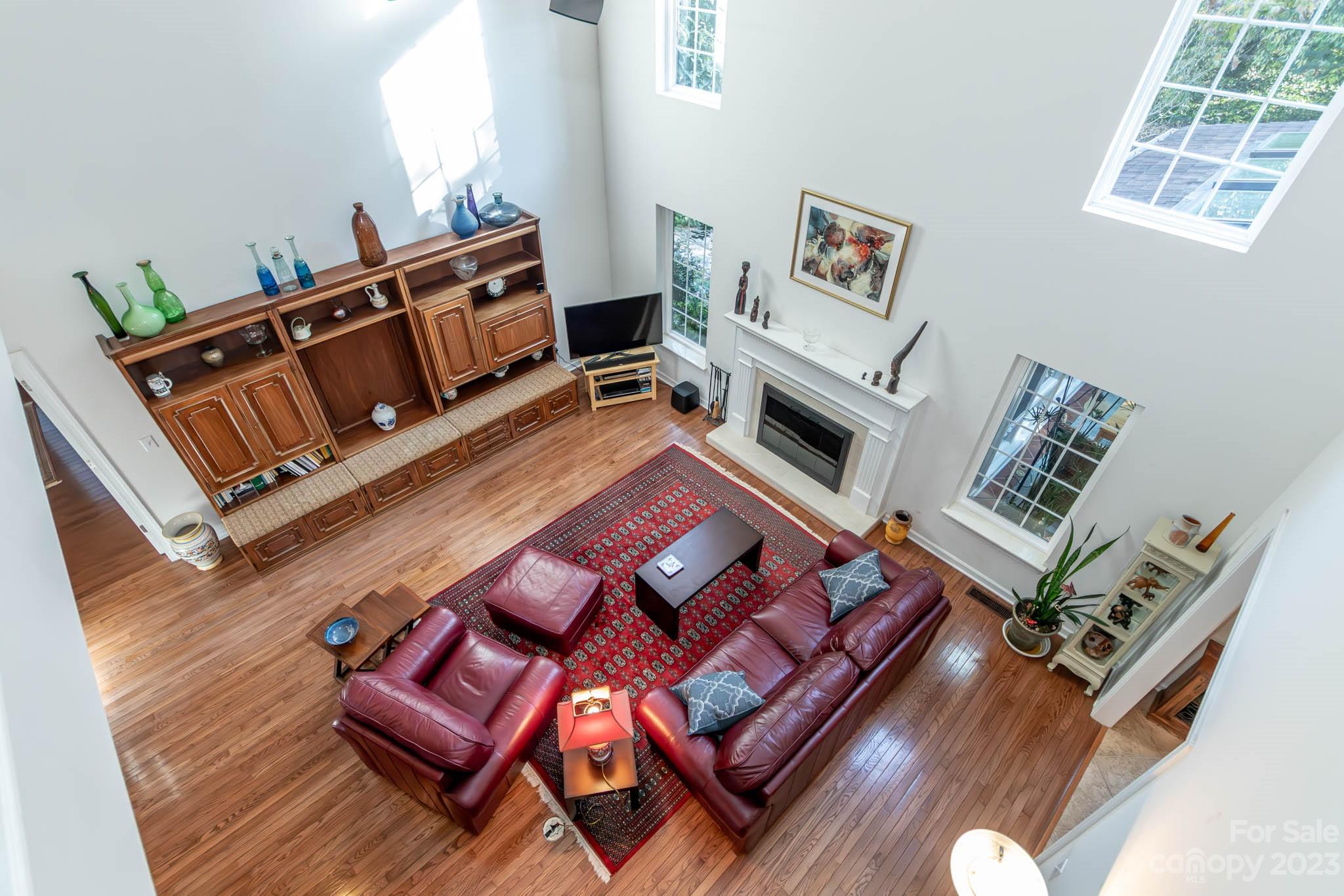 10507 Rougemont Lane Charlotte, NC 28277 - Photo 37 of 48 a living room with furniture rug and wooden floor