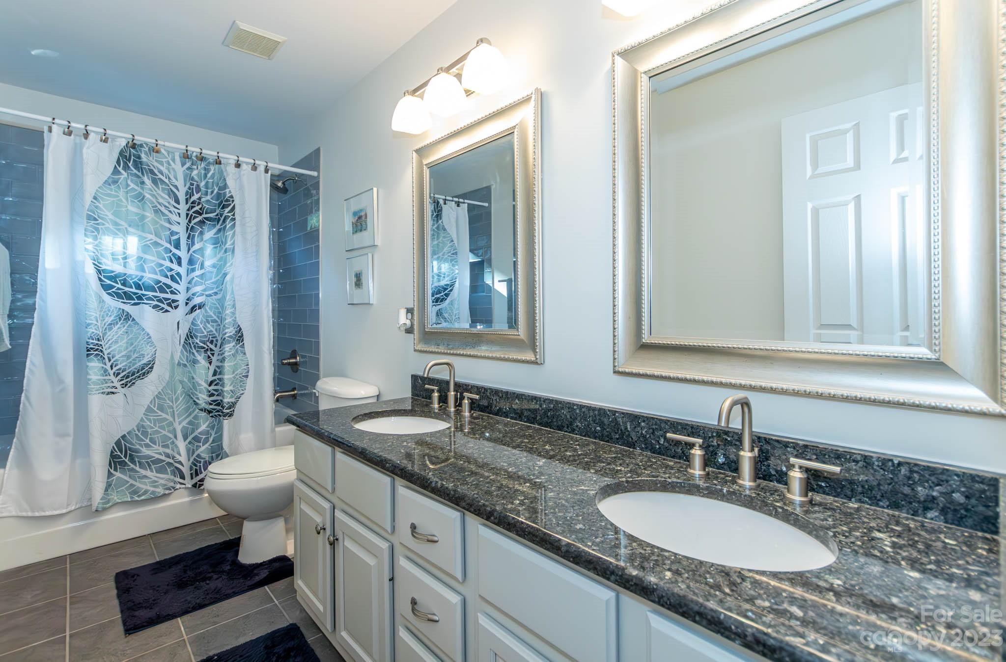 10507 Rougemont Lane Charlotte, NC 28277 - Photo 45 of 48 a bathroom with a granite countertop double vanity sink toilet and shower