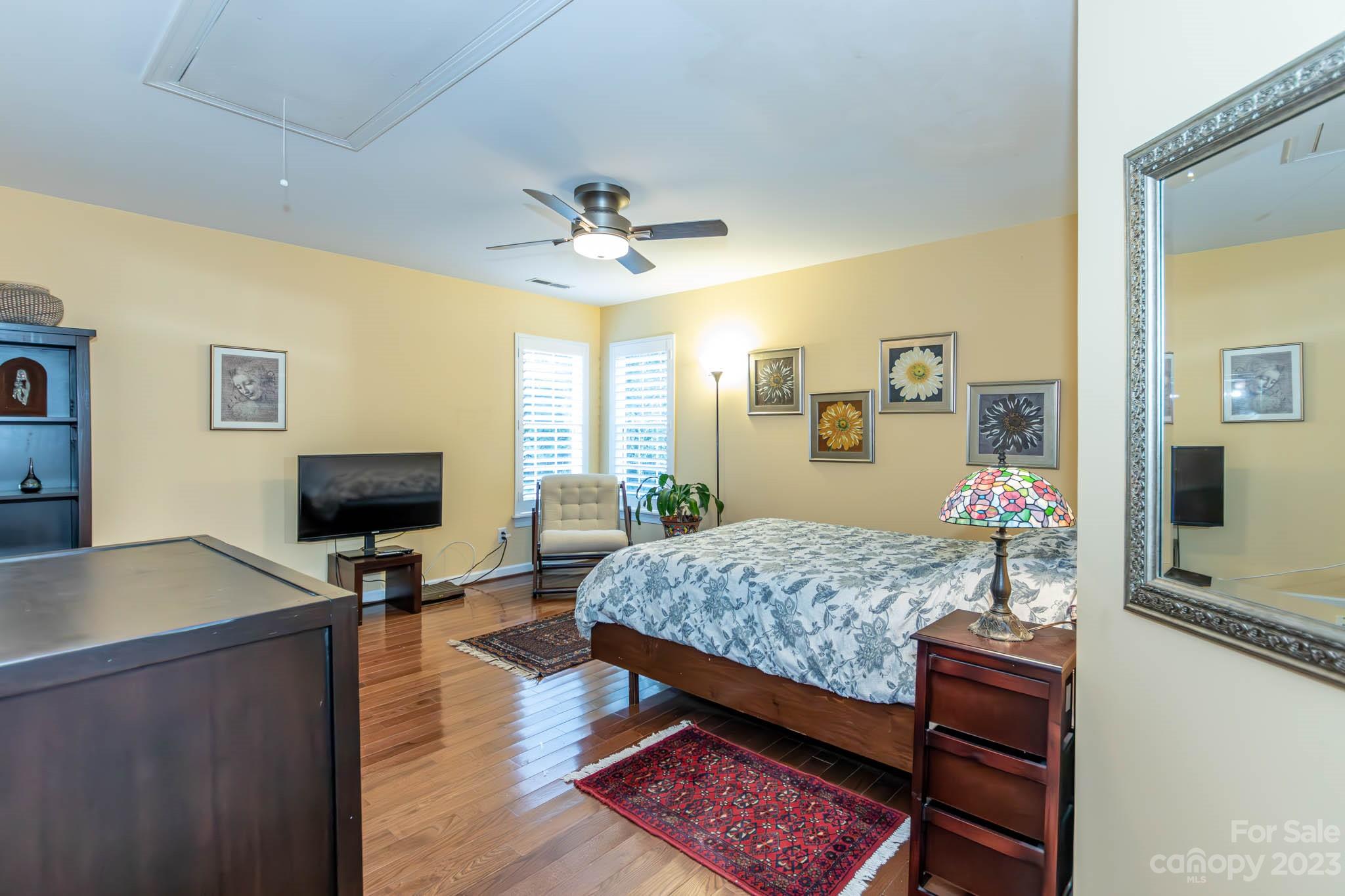 10507 Rougemont Lane Charlotte, NC 28277 - Photo 46 of 48 a bedroom with a bed and dresser with mirror