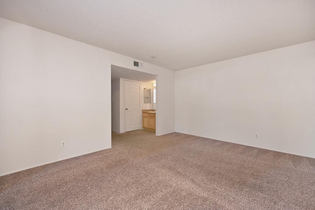 9160 Madison Avenue, Unit 57 Fair Oaks, CA 95628 - Photo 14 of 40 a view of an empty room and a window