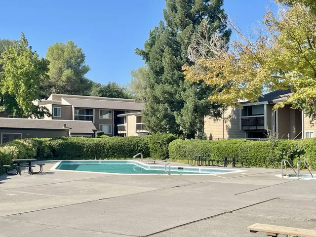 front view of a house next to a yard
