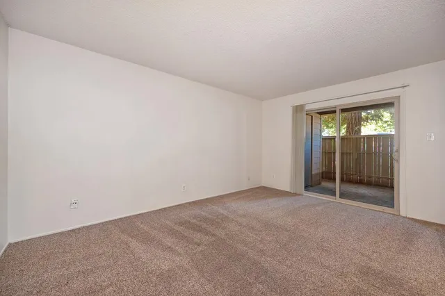 an empty room with sliding door