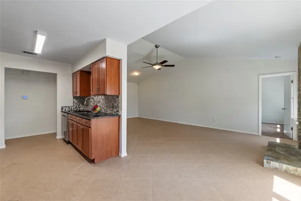 a kitchen with stainless steel appliances granite countertop a stove and a sink