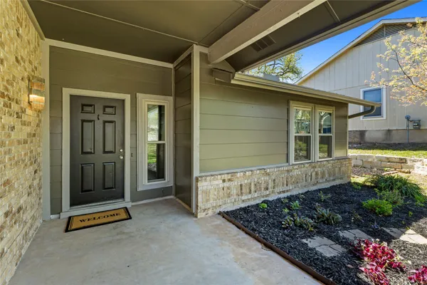 a front view of a house with a garage