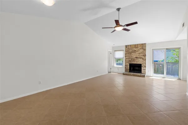 a view of empty room with fireplace