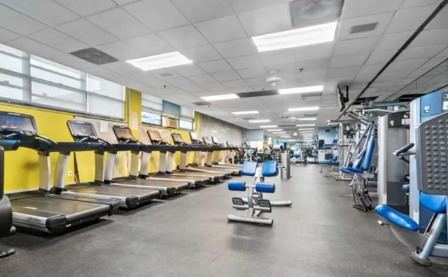 a view of a tennis court with a large bridge