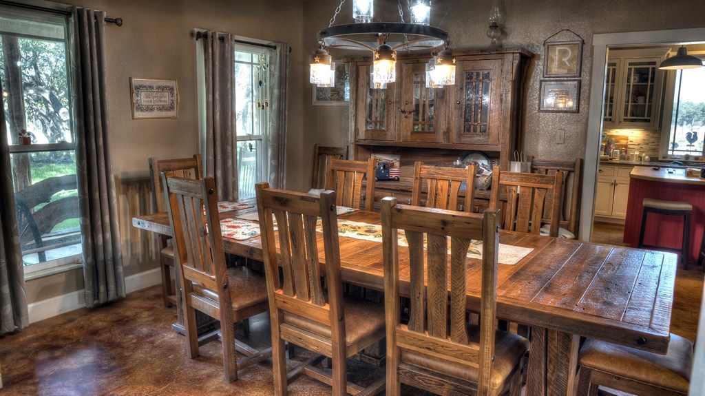 4573 Ranch Road 1120 Rio Frio, TX 78879 - Photo 19 of 71 a view of a dining room with furniture and chandelier
