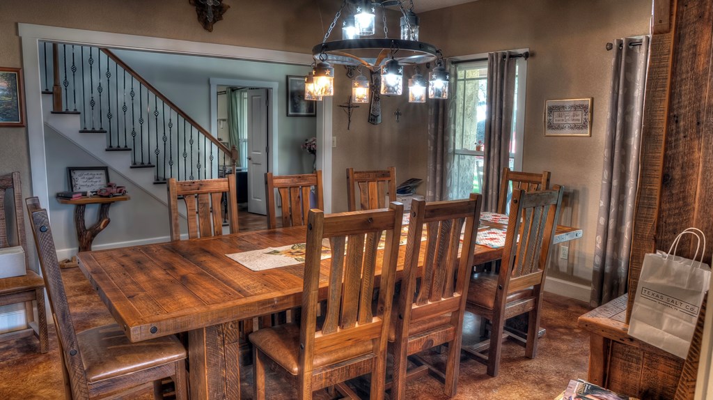 4573 Ranch Road 1120 Rio Frio, TX 78879 - Photo 22 of 71 a view of a dining room with furniture and a chandelier
